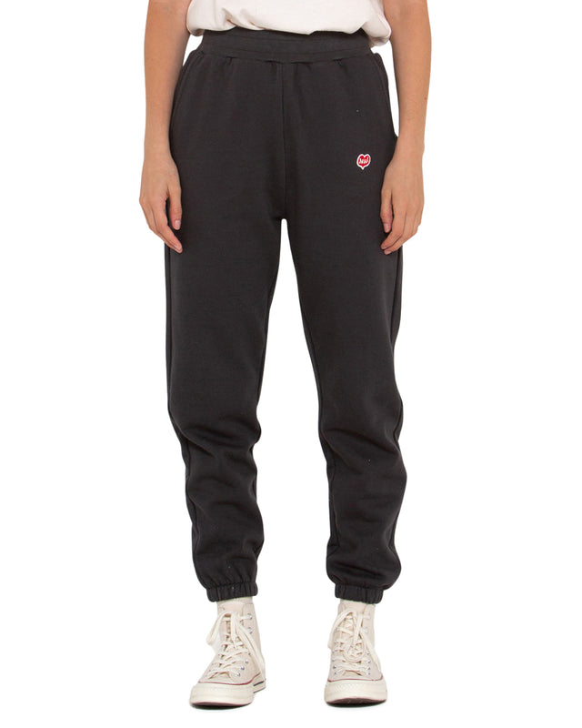 black relaxed fit track pant with front embroidered badge, elasticated drawstring waist, 100% organic cotton 450gm brushed back fleece fabrication with a heavy enzyme stone wash