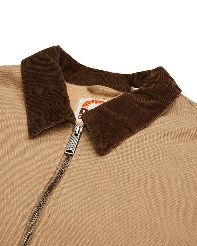 tan regular fit jacket with branded woven label at hem, contrast corduroy collar and pockets, sherpa lining, 100% cotton canvas fabrication with a heavy stone wash