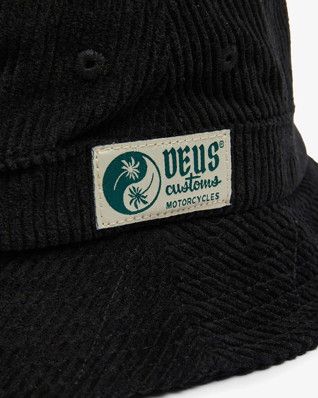 black 100% cotton corduroy 8 wale bucket hat with front branded label and cotton twill lining